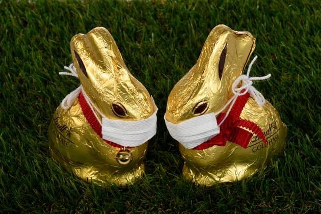 Symbol picture Easter during the Corona crisis, two chocolate Easter bunnies with mouthguards, Stuttgart, Baden Württemberg, Germany Refrigerator filled to bursting point