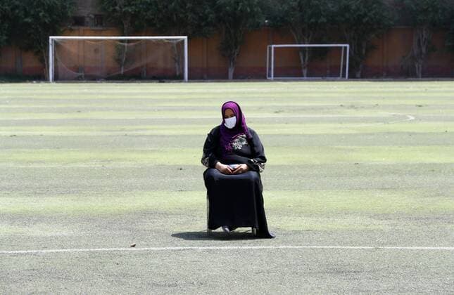 (200408) -- CAIRO, April 8, 2020 (Xinhua) -- A senior citizen wearing a face mask waits to receive her pension at a youth center on the outskirts of northern Cairo, Egypt, on April 8, 2020. The Egyptian Health Ministry reported on Wednesday 110 new cases and nine deaths of COVID-19, raising the total number of cases in the country to 1,560, including 103 deaths. (Xinhua Ahmed Gomaa) EGYPT-CAIRO-COVID-19 