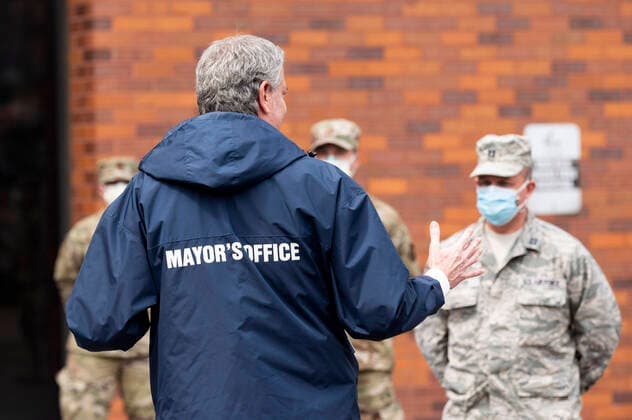 April 8, 2020, Bronx, NY, U.S: April 8, 2020 - Bronx, NY, United States: New York City Mayor BILL DE BLASIO (D) welcoming members of the United States Air Force who have been deployed to Lincoln Hospital. The mayor is seen here in a courtyard of Lincoln Hospital with U.S. Air Force personnel. Bronx U.S. - ZUMAb161 20200408_zap_b161_002 Copyright: xMichaelxBrochsteinx