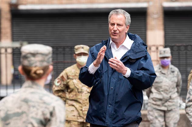 April 8, 2020, Bronx, NY, U.S: April 8, 2020 - Bronx, NY, United States: New York City Mayor BILL DE BLASIO (D) welcoming members of the United States Air Force who have been deployed to Lincoln Hospital. The mayor is seen here in a courtyard of Lincoln Hospital with U.S. Air Force personnel. Bronx U.S. - ZUMAb161 20200408_zap_b161_017 Copyright: xMichaelxBrochsteinx