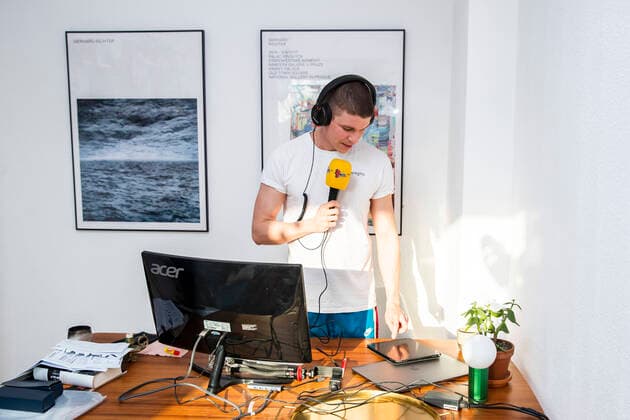 Journalist, blogger and radio presenter Florian Prokop broadcasts a radio report from his home office in Berlin on 8 April 2020 To sl