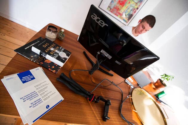 Journalist, blogger and radio presenter Florian Prokop broadcasts a radio report from his home office in Berlin on 8 April 2020 To sl