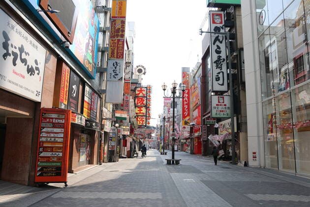 Few people are seen at Dotonbori shopping and amusement district in Osaka, Japan on April 8, 2020, a day after Japanese Prime Minister Shinzo Abe declared a month-long state of emergency for Tokyo, Osaka and five prefectures to curb the spread of the novel coronavirus.  (125155662)