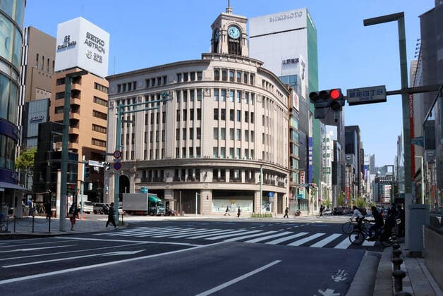 April 9, 2020, Tokyo, Japan - A few people and vehicles are seen at Tokyo s Ginza fashion district on Thursday, April 9, 2020. Japanese Prime Minister Shinzo Abe declared a state of emergency to fight outbreak of the new coronavirus on April 7.  (125181391)