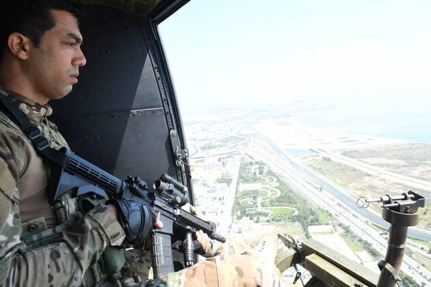 (200409) -- TUNIS, April 9, 2020 -- Photo taken on April 8, 2020 shows a Tunisian soldier patrolling by helicopter to maintain security during the COVID-19 outbreak in Tunis, Tunisia. In order to contain the spread of the COVID-19 infections, Tunisian government has suspended most of commercial and cultural activities, called on people to stay home and imposed curfews in various cities. (Photo by Adele Ezzine Xinhua) TUNISIA-TUNIS-SOLDIERS-PATROL-COVID-19 huangxling 