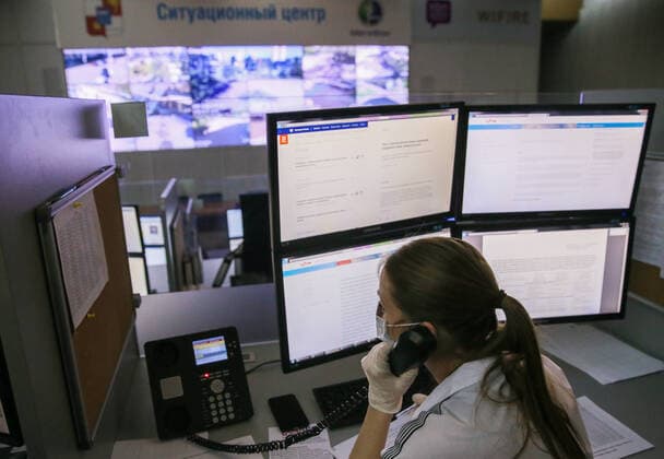 SOCHI, RUSSIA - APRIL 9, 2020: An operator speaking on a phone at a public safety answering point on the COVID-19 pandemic. Dmitry Feoktistov TASS  TS0D4EC3