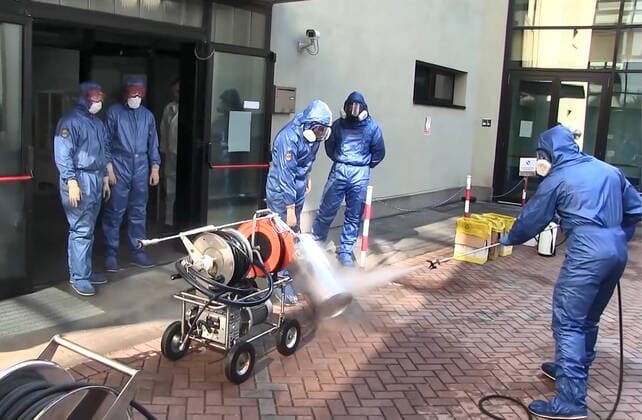 LOMBARDY, ITALY - APRIL 9, 2020: A video screen grab shows servicemen of the Russian Nuclear, Biological and Chemical Protection Troops carrying out disinfection procedures at the Pope John Paul I care home in Seriate to the south-east of Bergamo. As agreed by Russia s President Vladimir Putin and Italy s Prime Minister Giuseppe Conte, 15 military aircraft have arrived in Italy, carrying around 100 Russian military virologists and Defence Ministry experts in epidemiology, eight medical teams for COVID-19 patients and disinfection equipment. Russian Defence Ministry TASS  TS0D4ECE