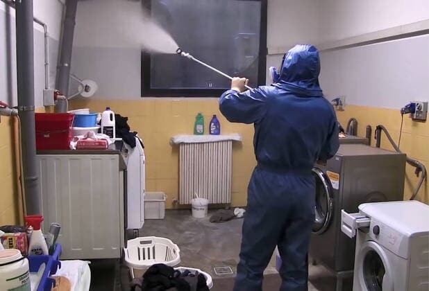LOMBARDY, ITALY - APRIL 9, 2020: A video screen grab shows a serviceman of the Russian Nuclear, Biological and Chemical Protection Troops carrying out disinfection procedures at the Pope John Paul I care home in Seriate to the south-east of Bergamo. As agreed by Russia s President Vladimir Putin and Italy s Prime Minister Giuseppe Conte, 15 military aircraft have arrived in Italy, carrying around 100 Russian military virologists and Defence Ministry experts in epidemiology, eight medical teams for COVID-19 patients and disinfection equipment. Russian Defence Ministry TASS  TS0D4ED7