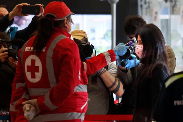 The Mayor of Rome Virginia Raggi, wearing a mask with painted hearts, undergoes the body scanner Rome April 9th 2020. Termini train station. Due to the coronavirus emergency, bodyscanner were introduced at the mayor train stations. Since this morning, the Red Cross together with the volunteers of the Order of Doctors, will take the temperature with a body scanner on passenger arriving at the train stations. Photo Samantha Zucchi Insidefoto SamanthaxZucchi
