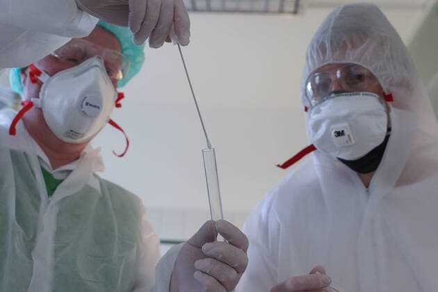 Coronavirus, mask shortage in German medical practices, doctor, medical practice, family doctor, doctor with mouth protection, FFP2 mask, respiratory mask with filter, and disposable protective goggles, safety glasses, laboratory, swab, search results web results swab tubes,