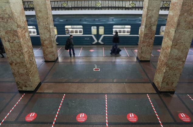 MOSCOW, RUSSIA - APRIL 9, 2020: Social distancing stickers at Park Kultury Station of the Moscow Metro amid the COVID-19 coronavirus pandemic. Russian President Vladimir Putin has expanded non-working period till April 30, 2020 to prevent the spread of the novel coronavirus. Stanislav Krasilnikov TASS  TS0D50EE