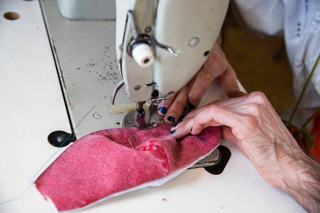Andrea Bonfini of Berlin fashion label Fade Out produces face masks, currently mainly for friends and acquaintances, in his studio in Berlin on April 9, 2020 The measures decided by the federal and state governments to slow down the spread of the coronavirus SARS CoV 2 will continue before Easter The debate about compulsory mouth protection and the effectiveness of the masks