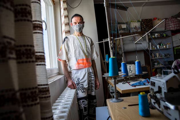 Andrea Bonfini of Berlin fashion label Fade Out produces face masks, currently mainly for friends and acquaintances, in his studio in Berlin on April 9, 2020 The measures decided by the federal and state governments to slow down the spread of the coronavirus SARS CoV 2 will continue before Easter The debate about compulsory mouth protection and the effectiveness of the masks