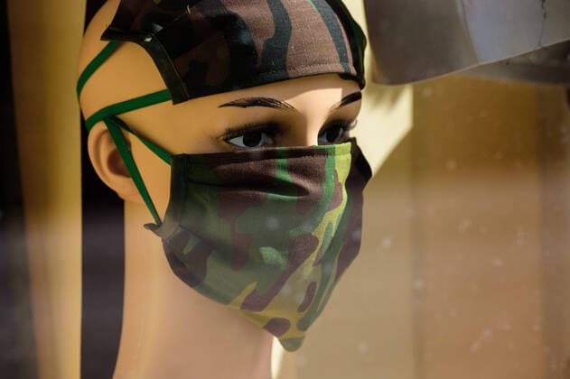 April 9, 2020, Berlin, Berlin, Germany: A mannequin with a self-sewn breathing mask in a camouflage pattern can be seen in a shop window. German Federal Government and the heads of government of the federal states adopted guidelines for further restricting social contacts in the public sector in view of the corona epidemic in Germany. Currently, meetings of more than two people are not allowed. As far as possible, a minimum distance of 1.5 meters must be maintained. Violations are punishable by a fine. Berlin Germany - ZUMAs172 20200409_zap_s172_011 Copyright: xJanxScheunertx