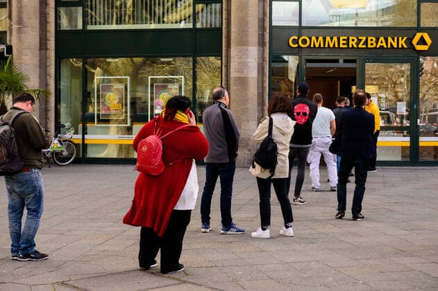 April 9, 2020, Berlin, Berlin, Germany: People wait in a queue outside a bank office. German Federal Government and the heads of government of the federal states adopted guidelines for further restricting social contacts in the public sector in view of the corona epidemic in Germany. Currently, meetings of more than two people are not allowed. As far as possible, a minimum distance of 1.5 meters must be maintained. Violations are punishable by a fine. Berlin Germany - ZUMAs172 20200409_zap_s172_019 Copyright: xJanxScheunertx