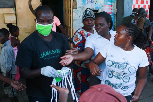 April 8, 2020, Nairobi, Kenya: Fabric face masks are being distributed to residents in Mathare Slums, one of the most densely populated slums in Nairobi..These items have been on demand after the Government directive on wearing face masks while in public places. On Monday, April 6, Kenyan President Uhuru Kenyatta announced a 21-day cessation of movement in and out of Nairobi and the counties of Kilifi, Kwale, and Mombasa due to the spread of COVID-19 in these regions. This followed a night curfew (7pm to 5am) that had been imposed just days before. Nairobi Kenya - ZUMAs197 20200408_zaa_s197_183 Copyright: xBonifacexMuthonix