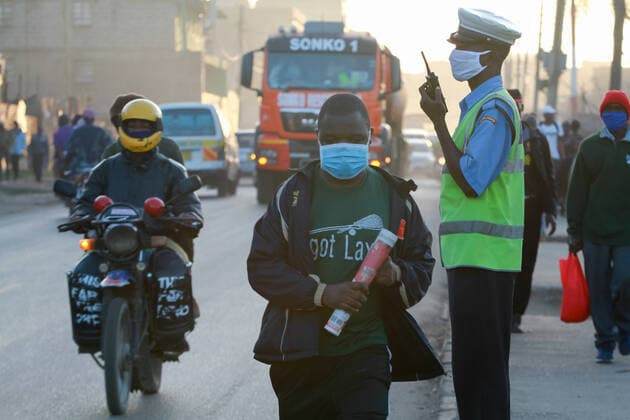 April 8, 2020, Nairobi, Kenya: A police officer controls traffic flow along Juja Road..These items have been on demand after the Government directive on wearing face masks while in public places. On Monday, April 6, Kenyan President Uhuru Kenyatta announced a 21-day cessation of movement in and out of Nairobi and the counties of Kilifi, Kwale, and Mombasa due to the spread of COVID-19 in these regions. This followed a night curfew (7pm to 5am) that had been imposed just days before. Nairobi Kenya - ZUMAs197 20200408_zaa_s197_185 Copyright: xBonifacexMuthonix