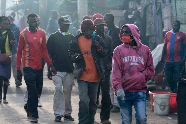 April 8, 2020, Nairobi, Kenya: Citizens in Mathare walk back home from work. Most of the residents in this area are casual laborers who depend on daily wages..These items have been on demand after the Government directive on wearing face masks while in public places. On Monday, April 6, Kenyan President Uhuru Kenyatta announced a 21-day cessation of movement in and out of Nairobi and the counties of Kilifi, Kwale, and Mombasa due to the spread of COVID-19 in these regions. This followed a night curfew (7pm to 5am) that had been imposed just days before. Nairobi Kenya - ZUMAs197 20200408_zaa_s197_187 Copyright: xBonifacexMuthonix