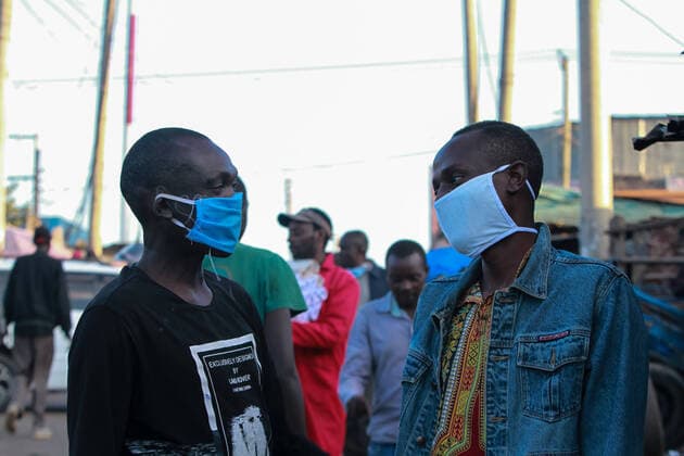 April 8, 2020, Nairobi, Kenya: Men wearing face masks as a precaution against the spread of coronavirus discuss in Mathare slums..These items have been on demand after the Government directive on wearing face masks while in public places. On Monday, April 6, Kenyan President Uhuru Kenyatta announced a 21-day cessation of movement in and out of Nairobi and the counties of Kilifi, Kwale, and Mombasa due to the spread of COVID-19 in these regions. This followed a night curfew (7pm to 5am) that had been imposed just days before. Nairobi Kenya - ZUMAs197 20200408_zaa_s197_189 Copyright: xBonifacexMuthonix