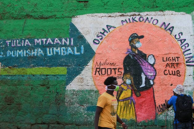 April 8, 2020, Nairobi, Kenya: A man walks past a mural that sensitises the Mathare slum residents on how to prevent themselves from contracting the Covid-19..These items have been on demand after the Government directive on wearing face masks while in public places. On Monday, April 6, Kenyan President Uhuru Kenyatta announced a 21-day cessation of movement in and out of Nairobi and the counties of Kilifi, Kwale, and Mombasa due to the spread of COVID-19 in these regions. This followed a night curfew (7pm to 5am) that had been imposed just days before. Nairobi Kenya - ZUMAs197 20200408_zaa_s197_190 Copyright: xBonifacexMuthonix