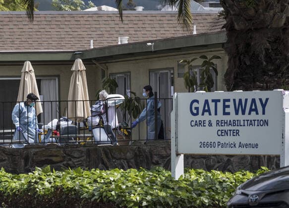 A patient is moved out of Gateway Care & Rehabillition Center, a skilled nursing facility in Hayward, California on Thursday, April 9, 2020. Thirty-five patients have tested positive for COVID-19 along with 24 staffers. Six patients have died.  SXP2020040904 TERRYxSCHMITT
