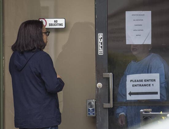 A visitor is turned away from Gateway Care & Rehabillition Center, a skilled nursing facility in Hayward, California on Thursday, April 9, 2020. Thirty-five patients have tested positive for COVID-19 along with 24 staffers. Six patients have died.  SXP2020040909 TERRYxSCHMITT