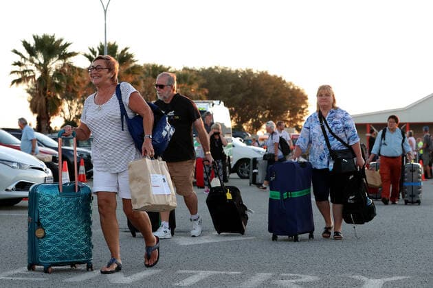 COVID-19 RETURNED TRAVELLERS WA, Passengers from the cruise ship Vasco da Gama are seen after disembarking from a Rottnest Express ferry at Fremantle harbour after completing their quarantine period on Rottnest Island on Friday, April 10, 2020. About 200 Western Australia passengers where transported to Rottnest Island after the Vasco da Gama docked in Fremantle harbour 15 days ago.( NO ARCHIVING, EDITORIAL USE ONLY, NO USE IN BOOKS WITHOUT CONSENT PERTH WA AUSTRALIA  Copyright: xRICHARDxWAINWRIGHTx 20200410001462852043