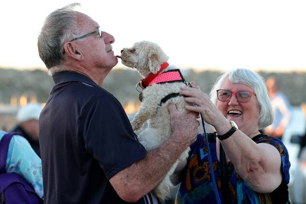 COVID-19 RETURNED TRAVELLERS WA, Bill and Faye Sibon, passengers from the cruise ship Vasco da Gama, are greeted by their dog Brandy after disembarking from a Rottnest Express ferry at Fremantle harbour after completing their quarantine period on Rottnest Island on Friday, April 10, 2020. About 200 Western Australia passengers where transported to Rottnest Island after the Vasco da Gama docked in Fremantle harbour 15 days ago.( NO ARCHIVING, EDITORIAL USE ONLY, NO USE IN BOOKS WITHOUT CONSENT PERTH WA AUSTRALIA  Copyright: xRICHARDxWAINWRIGHTx 20200410001462853217