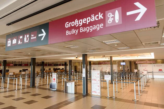 Due to the corona crisis, air traffic has largely ground to a standstill Empty check-in counters and waiting hall at Berlin Schönefeld Airport snapshot photography F Boillot