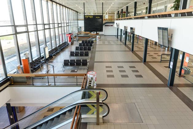 Due to the corona crisis, air traffic has largely ground to a standstill Empty check-in counters and waiting hall at Berlin Schönefeld Airport snapshot photography F Boillot