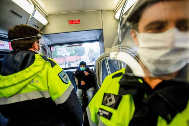 April 9, 2020, Porto, Portugal: Police officers checks passengers in a public transport for documentation during the Easter holidays amid Coronavirus outbreak in Porto..Easter period, From April 9th until April 13th the movement of people outside the municipality of residence is prohibited, and people will only be able to leave their municipality of residence if they have proof of the working entity. Within this period of time the police will inspect highways and public transports, this is done to prevent the spread of coronavirus in Portugal. Porto Portugal - ZUMAs197 20200409_zaa_s197_131 Copyright: xDiogoxBaptistax