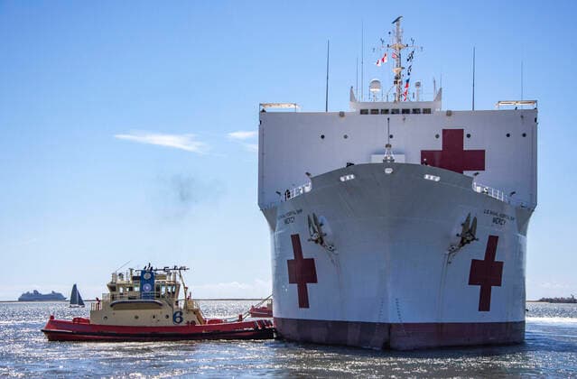 Los Angeles SAN DIEGO, USA -- 23 Mar 2020 -- The US Military Sealift Command hospital ship USNS Mercy (T-AH 19) departs San Diego, March 23, 2020. Mercy deployed in support of the nationis COVID-19 response efforts, and will serve as a referral hospital for non-COVID-19 patients currently admitted to shore-based hospitals. This allows shore base hospitals to focus their efforts on COVID-19 cases. One of the Department of Defenseis missions is Defense Support of Civil Authorities. DoD is supporting the Federal Emergency Management Agency, the lead federal agency, as well as state, local and public health authorities in helping protect the health and safety of the American people -- Picture by Atlas Photo Archive US Navy Natalie Myers, United States on 2020 03 23. Pictures 2020, PhotoCredit: Atlas Photo Archive US Navy Natalie Myer  EP_ATL
