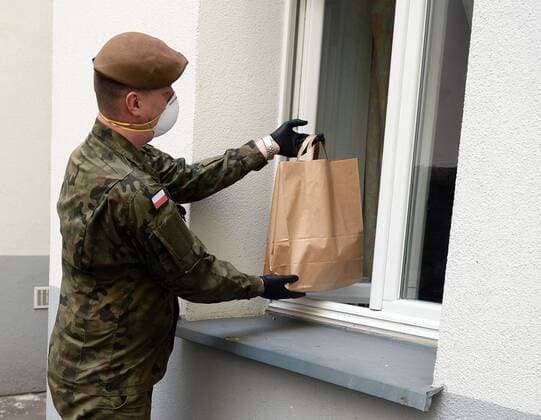 Soldiers of the Territorial Defense Forces deliver food packages before the Easter Soldiers of the Territorial Defense Forces deliver food packages before the Easter within charity action Neighbour to Neighbour to those in need during the coronavirus outbreak on April 10, 2020 in Warsaw, Poland, EN_01424278_0016 