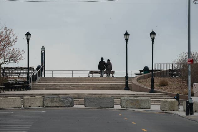 April 10, 2020, New York, NY, USA: A couple walks along a deserted boardwalk in the Coney Island section of the Borough of Brooklyn on April 10, 2020 in New York. New York USA - ZUMAb148 20200410_zap_b148_057 Copyright: xBryanxSmithx