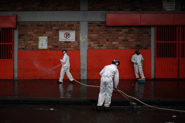 (200411) -- BOGOTA, April 11, 2020 (Xinhua) -- Members of staff disinfect a farm product market amid coronavirus pandemic in Bogota, Colombia, April 10, 2020. (Photo by Jhon Paz Xinhua) COLOMBIA-BOGOTA-COVID-19 