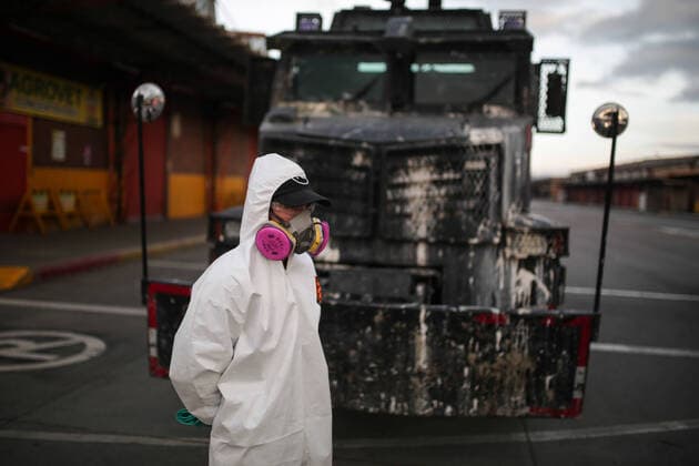 (200411) -- BOGOTA, April 11, 2020 (Xinhua) -- A staff member prepares to disinfect a farm product market amid coronavirus pandemic in Bogota, Colombia, April 10, 2020. (Photo by Jhon Paz Xinhua) COLOMBIA-BOGOTA-COVID-19 
