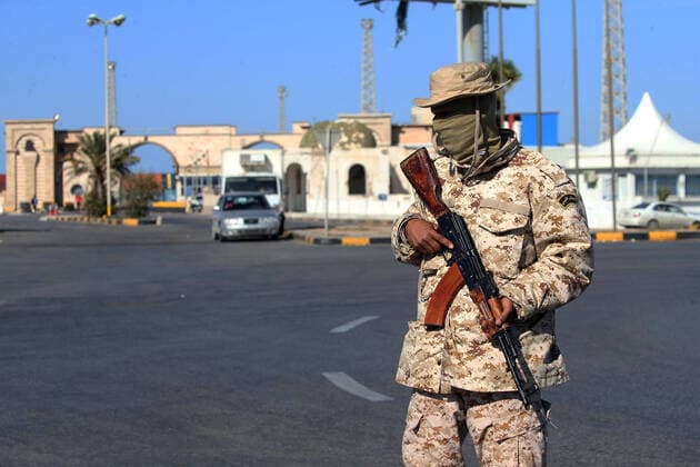 (200411) -- TRIPOLI, April 11, 2020 (Xinhua) -- Photo taken on April 10, 2020 show a Libyan soldier patrolling with a gun to maintain security during the COVID-19 outbreak in Tripoli, Libya. (Photo by Hamza Turkia Xinhua) LIBYA-TRIPOLI-SOLDIERS-PATROL-COVID-19 