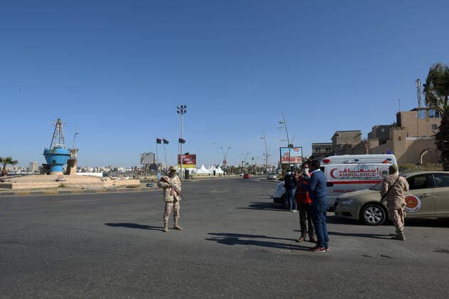 (200411) -- TRIPOLI, April 11, 2020 (Xinhua) -- Photo taken on April 10, 2020 show Libyan soldiers patrolling with a gun to maintain security during the COVID-19 outbreak in Tripoli, Libya. (Photo by Hamza Turkia Xinhua) LIBYA-TRIPOLI-SOLDIERS-PATROL-COVID-19 