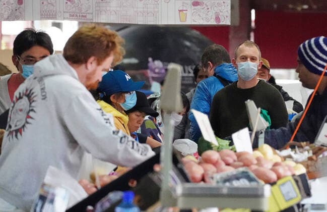 AUSTRALIA CORONAVIRUS COVID-19, People shop at the Queen Victoria Market while wearing face masks as a preventive measure against the spread of novel coronavirus COVID-19 in Melbourne, Saturday, April 11, 2020. Authorities have said social distancing and isolation measures could still remain in place for the next six months. A shutdown of non-essential services is in effect Australia wide in a bid to slow the spread of the coronavirus (COVID-19) disease. ( NO ARCHIVING, EDITORIAL USE ONLY, NO USE IN BOOKS WITHOUT CONSENT MELBOURNE VIC AUSTRALIA  Copyright: xSCOTTxBARBOURx 20200411001463003655