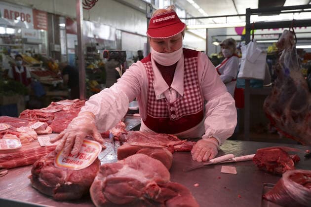 NOVOSIBIRSK, RUSSIA - APRIL 11, 2020: Meat for sale at the Oktyabrsky food market. Russian President Vladimir Putin has expanded non-working period till April 30, 2020 to prevent the spread of the novel coronavirus. Kirill Kukhmar TASS  TS0D5472