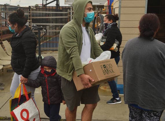 Free warm vegetarian meals are distributed to the public at the Khalsa Care Foundation amid the coronavirus pandemic in in Los Angeles on Friday, April 10, 2020.  LAP2020041002 JIMxRUYMEN