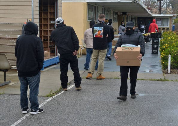 Free warm vegetarian meals are distributed to the public at the Khalsa Care Foundation amid the coronavirus pandemic in in Los Angeles on Friday, April 10, 2020.  LAP2020041007 JIMxRUYMEN