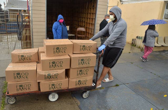 Free warm vegetarian meals are distributed to the public at the Khalsa Care Foundation amid the coronavirus pandemic in in Los Angeles on Friday, April 10, 2020.  LAP2020041009 JIMxRUYMEN