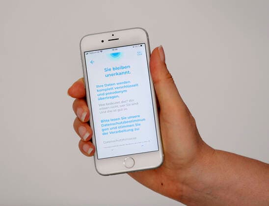 11 04 2020, Coronavirus App on a smartphone The data donation app from the Robert Koch Institute RKI installed on an iphone transmits health and activity data for faster containment of the pandemic You remain undetected Your data is completely encrypted and transmitted pseudonymously 11 04 2020, Coronavirus App on the RKI to the smartphone 11 04 2020, Coronavirus App on the RKI to the smartphone