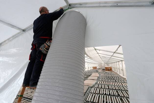 A worker assembles a pipe at a field hospital, set up outside La Fe hospital, amid coronavirus outbreak, in Valencia, eastern Spain, 11 April 2020. The hospital will have 600 beds. A field hospital is set up in Valencia amid coronavirus outbreak !ACHTUNG: NUR REDAKTIONELLE NUTZUNG!  Copyright: xKaixFörsterlingx GRAFCVA4038 20200411-637222072087368870