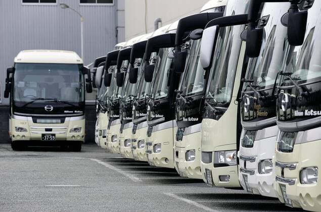 New coronavirus Photo taken in Higashiosaka, Osaka Prefecture, western Japan, on April 11, 2020, shows tour buses at a depot, which have been stranded since mid-March as people have shunned bus tours amid a surge in coronavirus infections. 