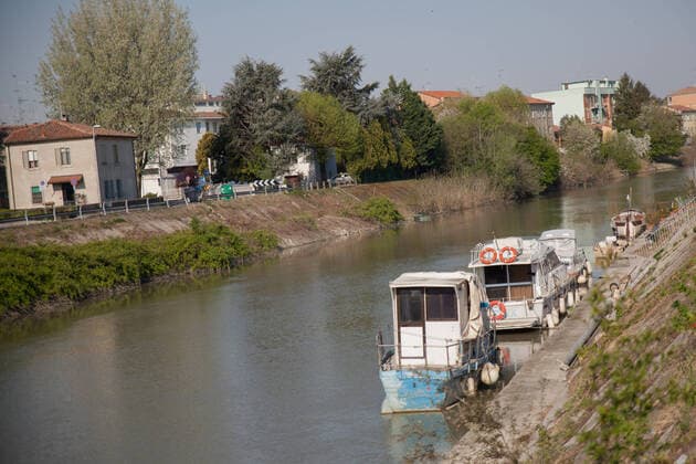 Italy: Dock of Ferrara during the COVID-19 The beautiful dock of Ferrara with peace and quiet during the COVID-19 emergency. Ferrara Emilia Romagna Italy Copyright: CarloxVergani