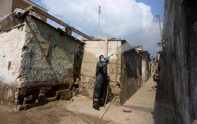 April 11, 2020, Dair Al Balah, Gaza Strip, Palestinian Territory: Palestinian workers spray disinfectant as a preventive measure amid fears of the spread of the coronavirus disease (COVID-19), in Dair Al Balah in the center of Gaza strip, on April 11, 2020 Dair Al Balah Palestinian Territory - ZUMAap3_ 20200411_zaf_ap3_063 Copyright: xAshrafxAmrax