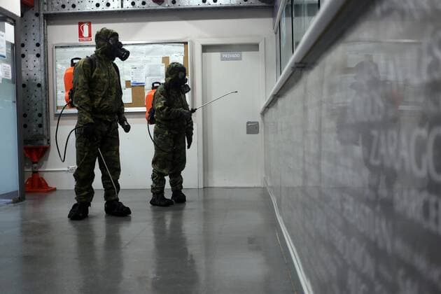 Spain: 29th day of alert status for CoVid-19 Gijon, SPAIN: Two soldiers clean the office to buy ALSA tickets during the 29th day of the State of Alert in Spain, in Gijon, Spain on April 11, 2020. Gijon Asturias Spain Copyright: AlbertoxBrevers