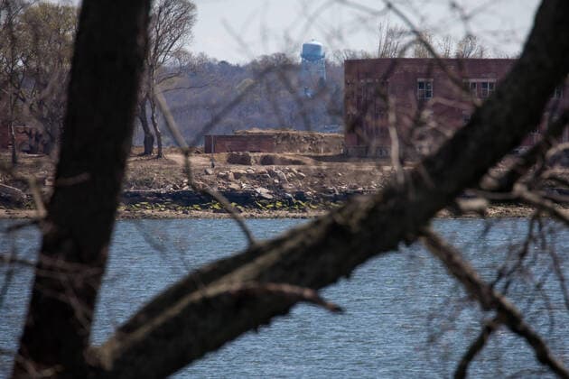 (200411) -- NEW YORK, April 11, 2020 -- A large burial pit and abandoned buildings are seen on Hart Island where some of the COVID-19 victims are buried, in New York, the United States, April 11, 2020. The death toll from COVID-19 in the United States surpassed that in Italy on Saturday, reaching 19,701 as of 1: 35 p.m. (1735 GMT) among 506,188 cases, according to data compiled by Johns Hopkins University. (Photo by Michael Nagle Xinhua) U.S.-NEW YORK-COVID-19-DEATH TOLL WangxYing